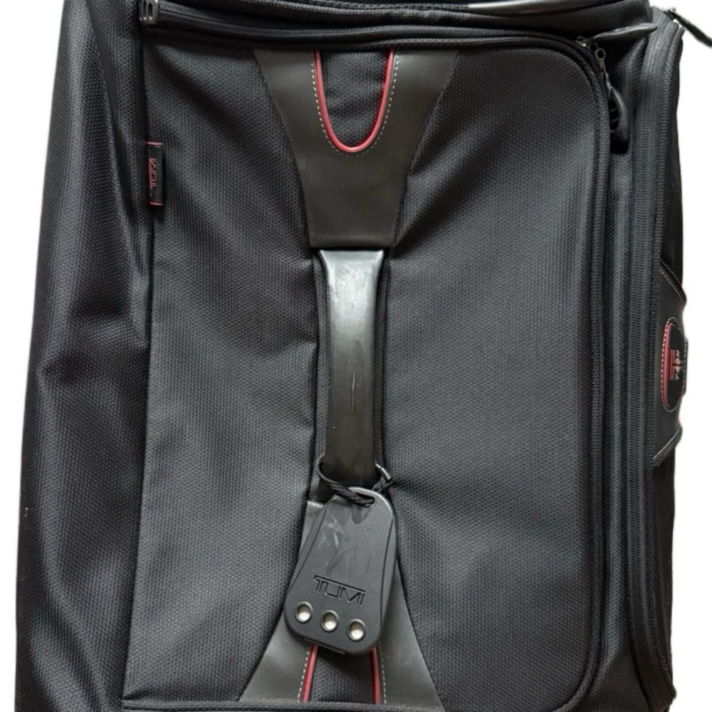 Tumi Black Luggage Travel Bag with Sleek Design